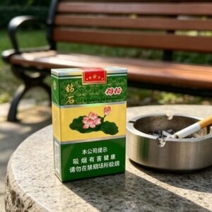 Lotus Flower Green cigarettes pack with traditional Chinese floral design, green and yellow packaging displayed on wooden table