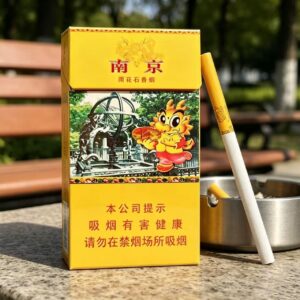 Nanjing Yuhua Stone Chinese cigarette pack with slim cigarette on wooden table and tea cup premium yellow tobacco packaging