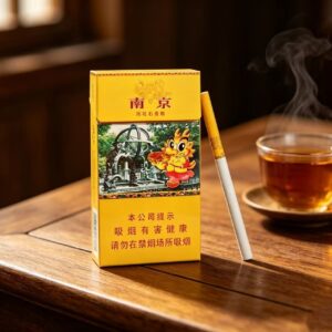 Nanjing Yuhua Stone Chinese cigarette pack with slim cigarette on wooden table and tea cup premium yellow tobacco packaging