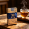 Yellow Crane Tower Blue Pack Chinese cigarette pack on wooden table with tea cup premium blue and gold tobacco packaging
